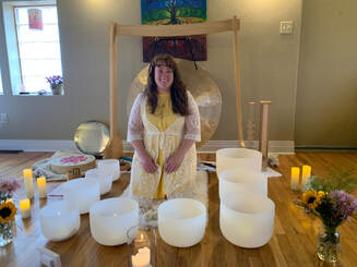 Image of Jenn at SCA with singing bowls and gong